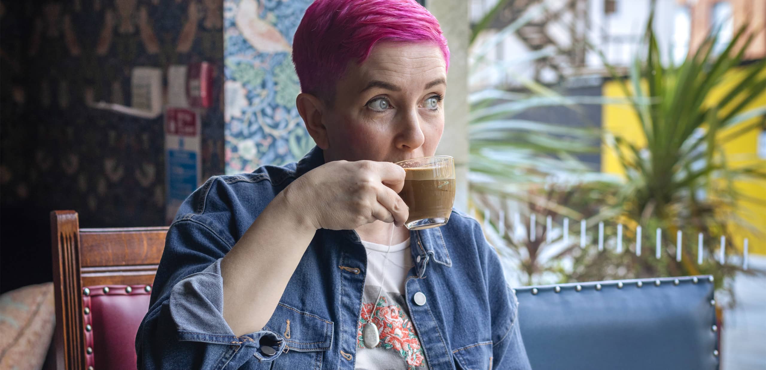 Oldham resident drinking coffee at local cafe